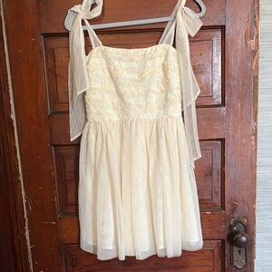 Privy Cream Sundress with Spaghetti Straps and Flutter Sleeves
